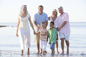 Extended family at the beach smiling