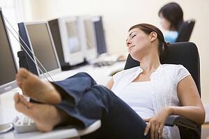 Woman in computer room sleeping