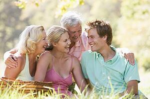 Parents with adult children on picnic