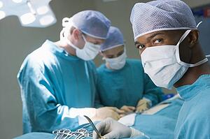 Four Surgeons Getting Ready To Operating On A Patient