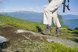 Woman's legs hiking outdoors in scenic location
