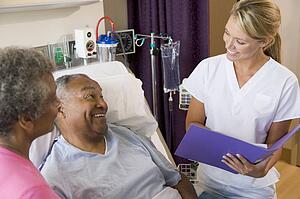 Doctor Making Notes About Patient