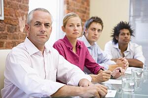 Four businesspeople in boardroom