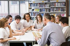 Students and teacher in a study group collaborating