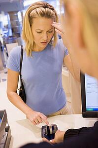 Woman trying to remember credit card PIN number