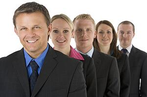 Group Of Business People In A Line Smiling 