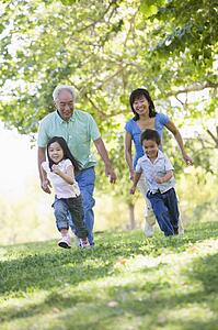 Grandparents running with grandchildren.