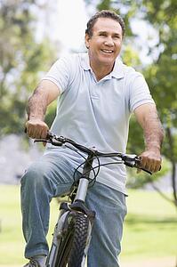 Man on bike outdoors smiling