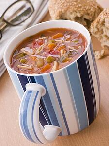 Cup Of Vegetable And Pasta Soup With A Granary Bread Roll