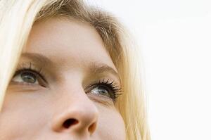 Head shot of woman thinking