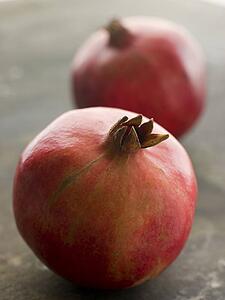 Two whole pommegranates