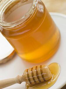 Jar of honey and spoon