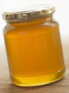 Jar of honey and spoon