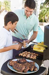 Father And Son Barbequing