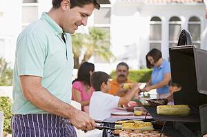 Family Enjoying A Barbeque