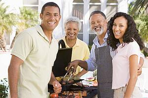 Family Enjoying A Barbeque