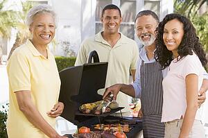 Family Enjoying A Barbeque