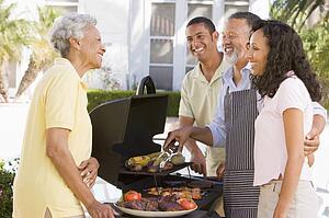Family Enjoying A Barbeque