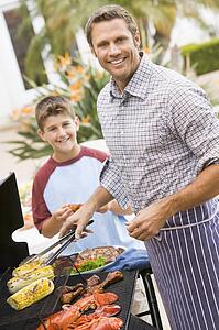 Father And Son Barbequing