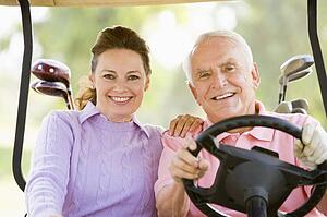 Couple Enjoying A Game Of Golf
