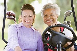 Portrait Of Two Female Golfers