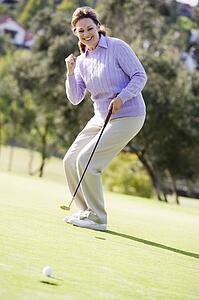Woman Playing A Game Of Golf