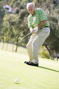 Man Playing A Game Of Golf
