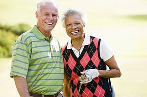 Couple Enjoying A Game Of Golf