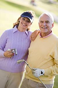 Couple Enjoying A Game Of Golf