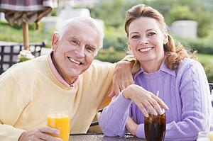 Couple Enjoying A Beverage By A Golf Course