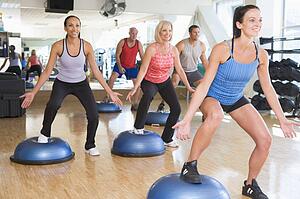Instructor Taking Exercise Class At Gym