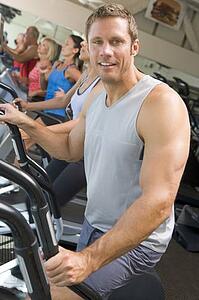 Man Running On Treadmill At Gym