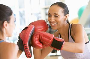 Women Boxing Together At Gym