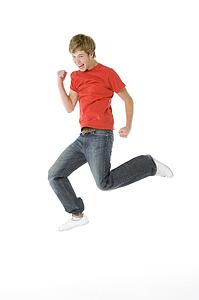 Teenage Boy Jumping In The Air