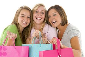 Portrait Of Teenage Girls Holding Shopping Bags