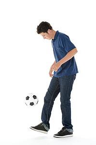 Portrait Of Teenage Boy With A Soccer Ball