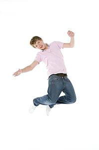 Teenage Boy Jumping In The Air
