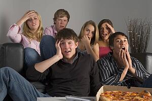 Teenagers Having Fun And Eating Pizza