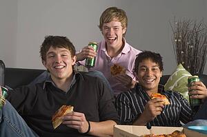 Teenage Boys Eating Pizza