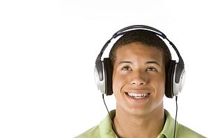 Teenage Boy Listening To Music On Headphones