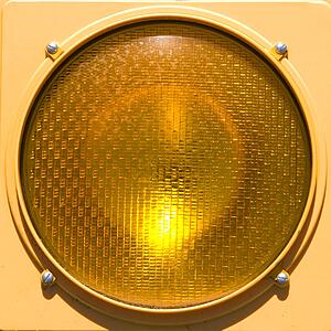 Closeup of yellow traffic stoplight