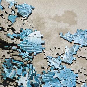Pieces of old puzzle lying scattered about.
