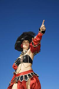 Young adult female dressed in pirate costume.