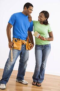 Portrait of smiling couple with tools