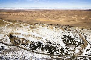 Aerial landscape of snowy plains and dunes in Great Sand Dunes National Park, Colorado