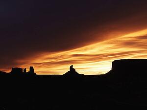 Scenic sunset landscape of mesas in Monument Valley near the border of Arizona and Utah, United States.