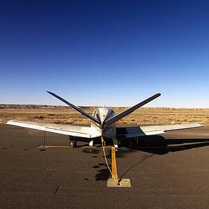Plane parked on tarmac at Canyonlands Field Airport, Utah, United States