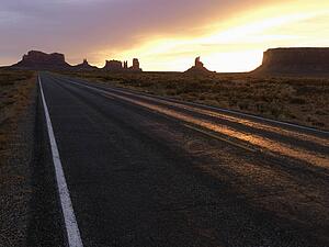 Scenic sunset landscape of highway in Monument Valley