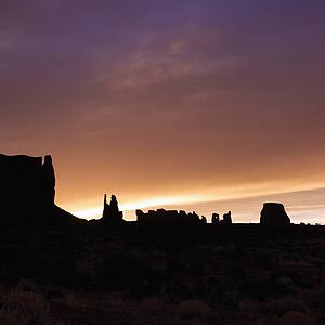 Scenic sunset landscape of mesas in Monument Valley 