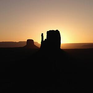 Scenic sunset landscape of mesas in Monument Valley